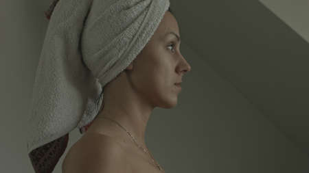Beautiful sexy woman with towel on her hairs after bath.の写真素材