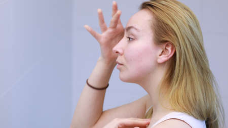 Young woman caring of her skin.の写真素材