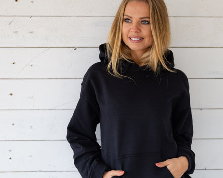 Woman with black space on hoodieの写真素材