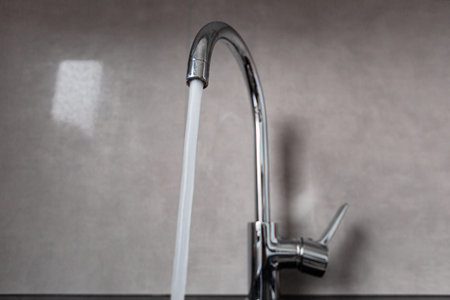 Silver faucet in bathroom