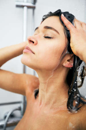 Woman enjojing the showerの写真素材
