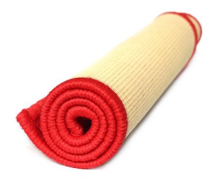 Rolled door mat over white backgroundの写真素材
