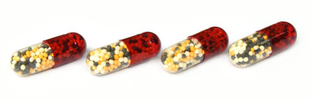 Close up of capsules over white background