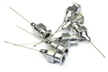 Old needles over white backgroundの写真素材