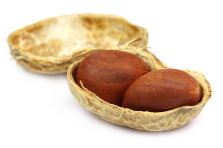 Peeled peanut over white background