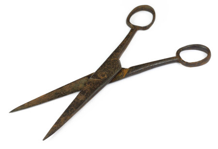 Old hair cutting scissor over white background