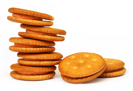Double layer cream cookies over white background