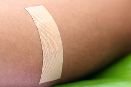 Close up of a plaster on human skin