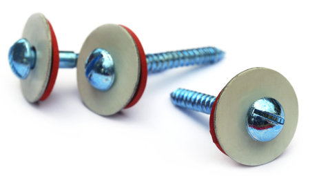 Screw with washer over white background