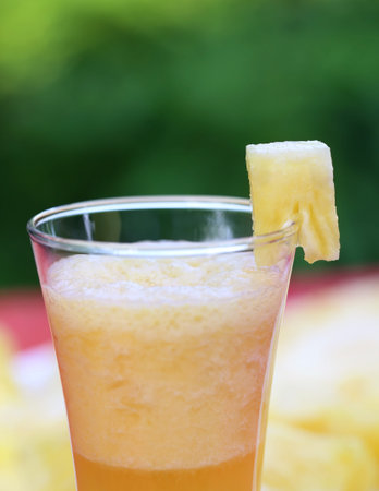 Pineapple juice in a glass outdoor