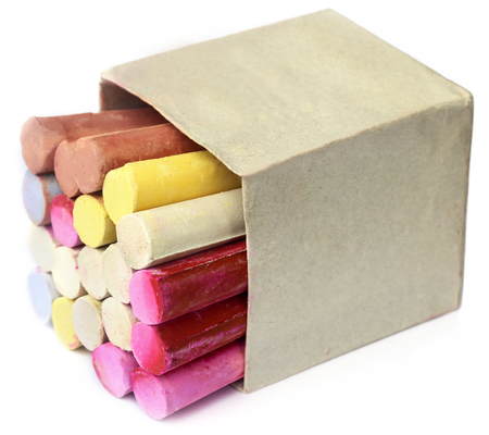 Colorful  chalk in a box over white backgroundの写真素材