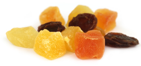 Dried fruits apricot, papaya and raisin over whiite backgroundの写真素材
