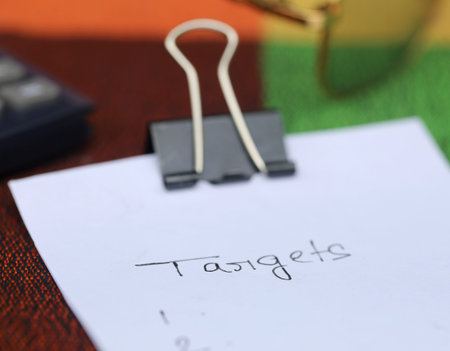 Paper clip with white paper written Targets
