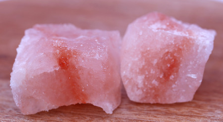Saindhava lavana or Himalayan Pink rock salt on wooden surfaceの写真素材