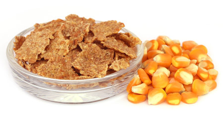 Corns with flakes over white background