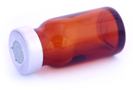 Brown vial over white backgroundの写真素材