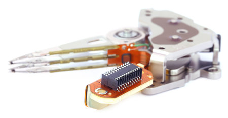 Parts of a hard disk over white background