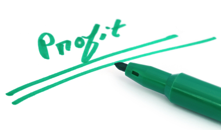 Profit written with a green sign pen over white backgroundの写真素材