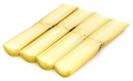 Pieces of sugarcane over white backgroundの写真素材