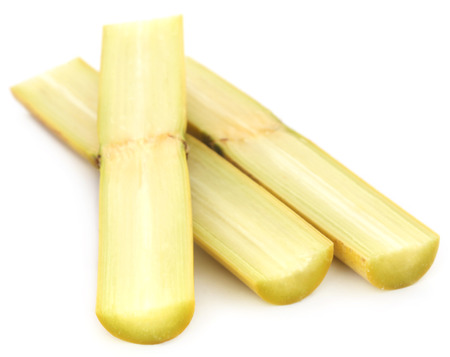 Pieces of sugarcane over white backgroundの写真素材