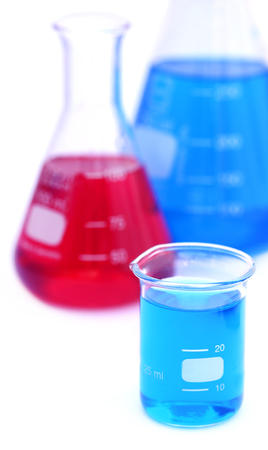 Beaker and conical flask over white backgroundの写真素材