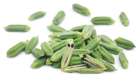 Sesame seeds with green pods over white backgroundの写真素材