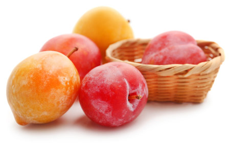 Fresh plums over white backgroundの写真素材