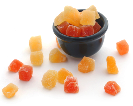Dried fruits apricot and papaya with some others in bowl over whiteの写真素材