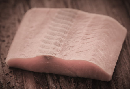 Uncooked salmon fish on wooden surface