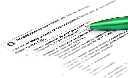 Canada Visa application form details with green ballpoint