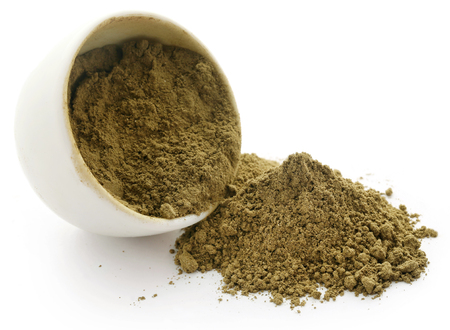 Henna hair dye powder on a bowl over white backgroundの写真素材