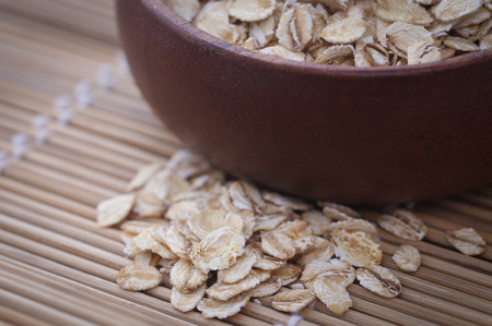 Whole oats closeup on textured natural surfaceの写真素材