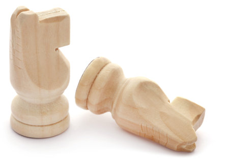 Wooden chess knight over white backgroundの写真素材