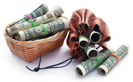 Rolled US Dollar over white backgroundの写真素材