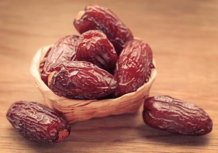 Arabian Dates on wooden surfaceの写真素材