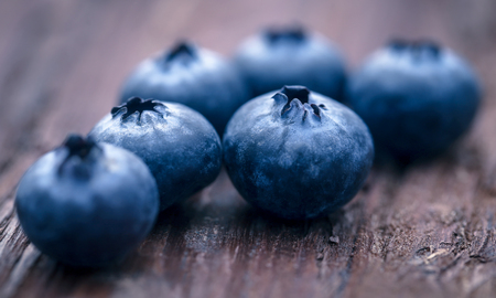 Group of fresh blueberries on natural surfaceの写真素材