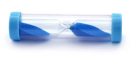 Blue Hourglass over white backgroundの写真素材