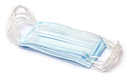Surgical face masks over white background