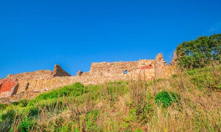 Rocky coastal area around Hammershus Ruins Castle in Bornholm, Denmarkの写真素材