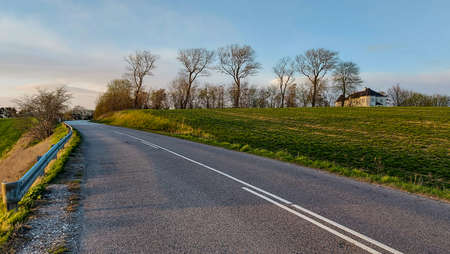 Road throught Danish agricultural field in Roskildeの写真素材