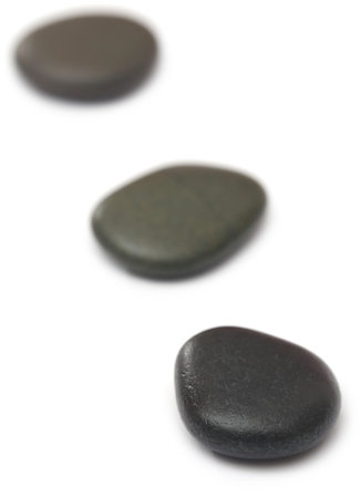 Massage stone isolated over white backgroundの写真素材