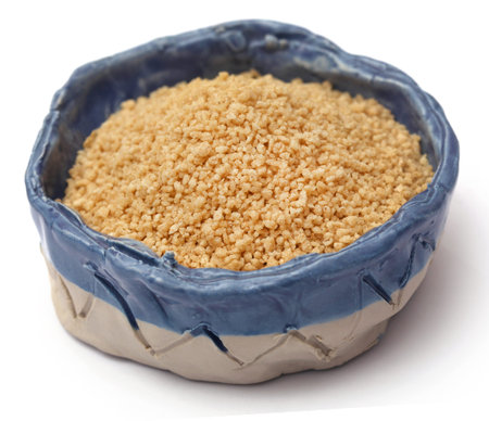 Uncooked couscous over white backgroundの写真素材