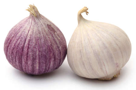 Solo or single clove garlic over white backgroundの写真素材