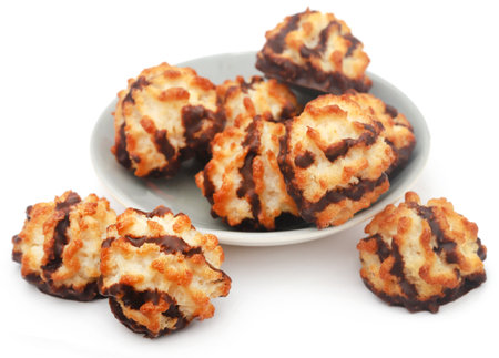Tasty coconut chocolate cookies over white backgroundの写真素材