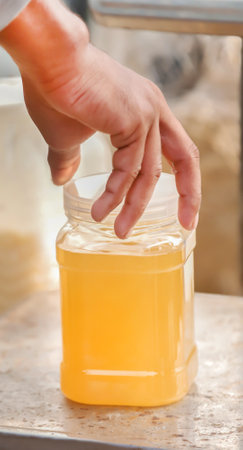 Freshly harvested honey in a jarの写真素材