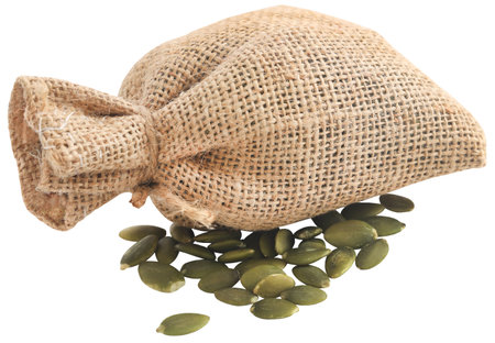 Peeled organic pumpkin seeds in a jute sackの写真素材