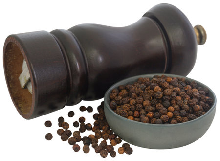 Wooden pepper mill with black pepper closeupの写真素材