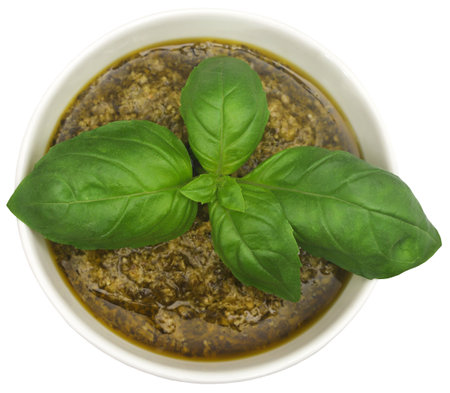 Fresh basil leaves with pesto in a bowlの写真素材