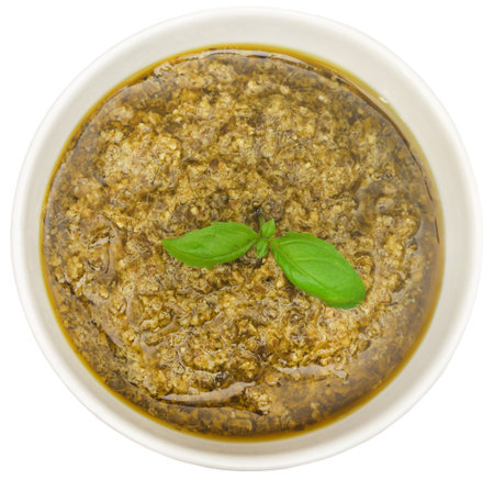 Fresh basil leaves with pesto in a bowlの写真素材