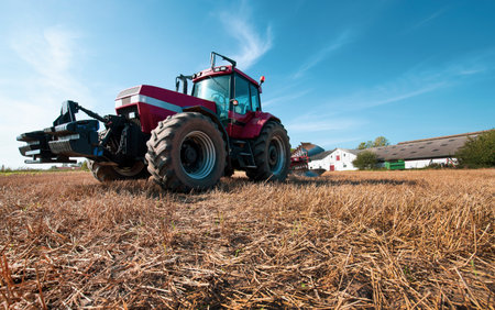 Danish agricultural farm tractor in field on a sunny dayの写真素材